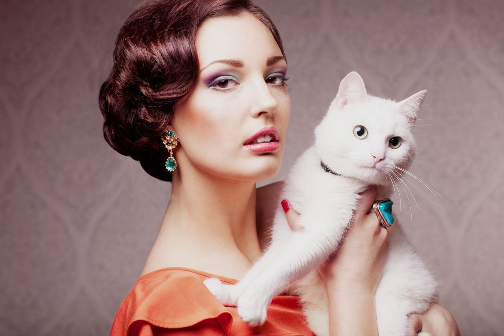 elegant woman with a white cat